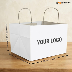White paper bag with dimensions and 'Your Logo' placeholder text on a wooden surface.