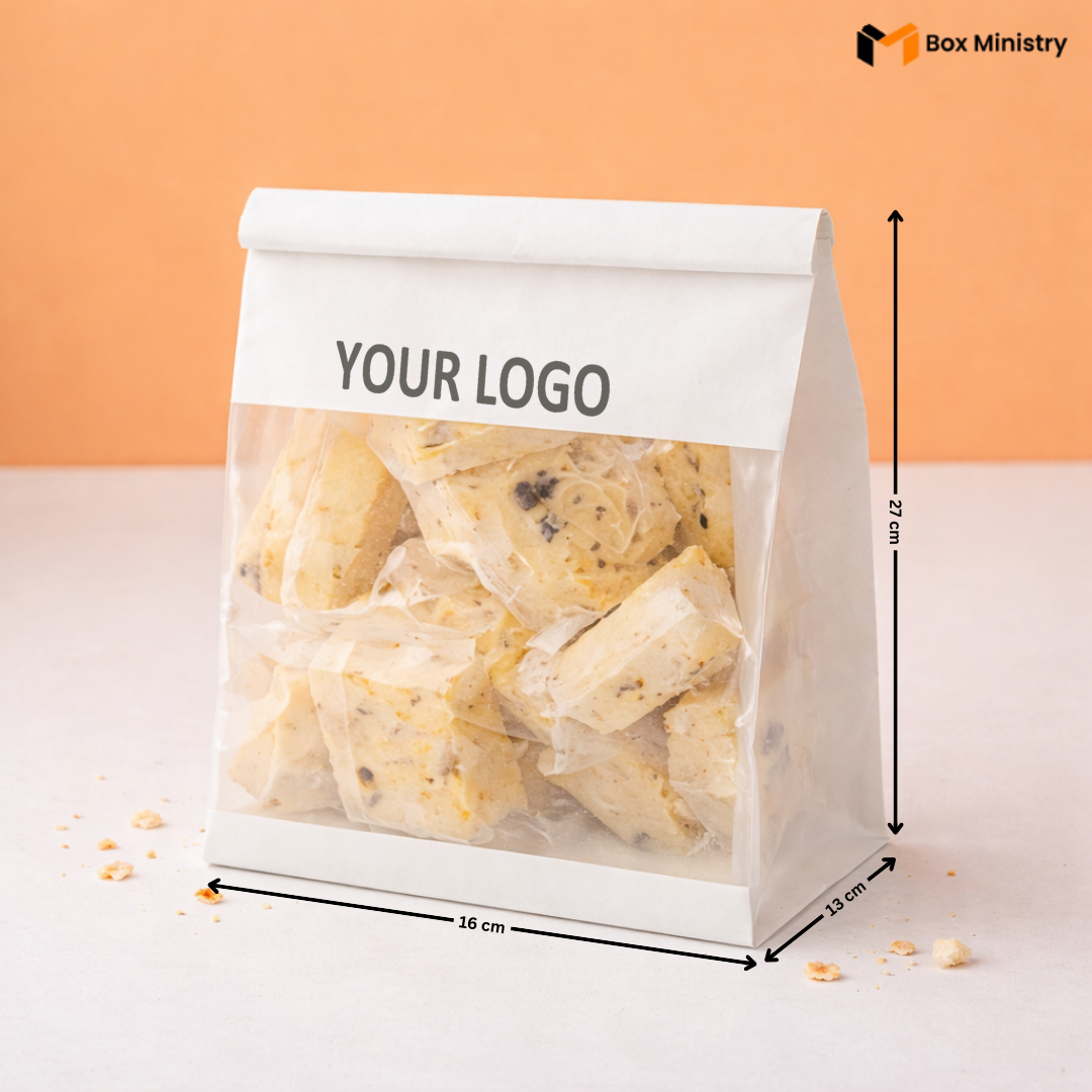 White paper bag with cookies and 'Your Logo' text, dimensions indicated, on a peach background.