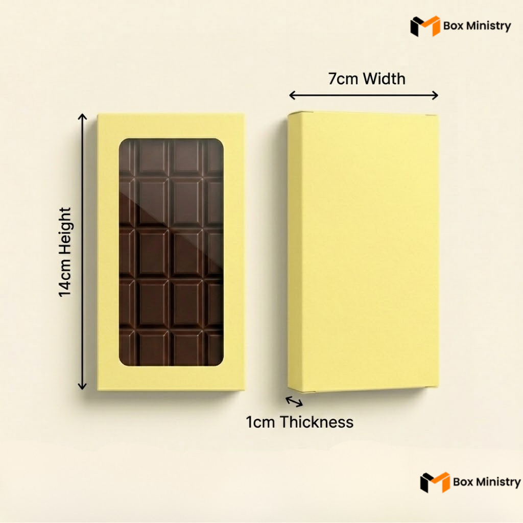 Yellow chocolate box with a window showing a chocolate bar, labeled with dimensions on a beige background.