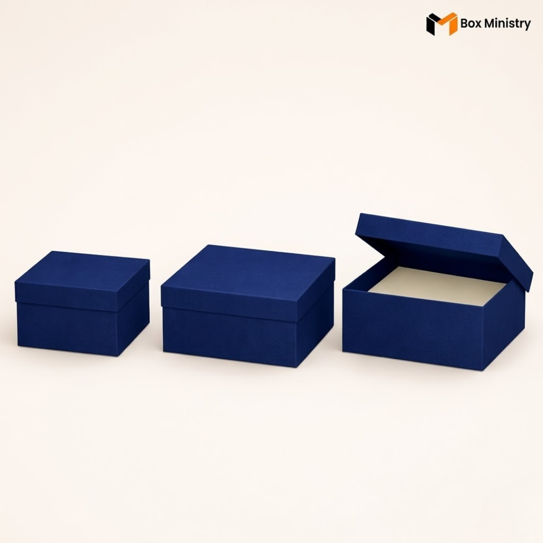 Three blue boxes of different sizes on a white background with 'Box Ministry' branding.