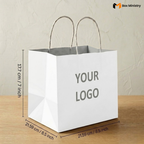 White paper bag with dimensions and 'Your Logo' placeholder text on a wooden surface.