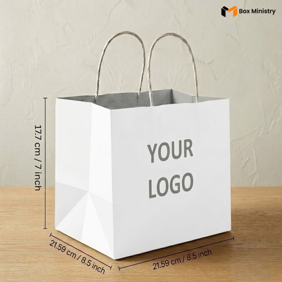 White paper bag with dimensions and 'Your Logo' placeholder text on a wooden surface.