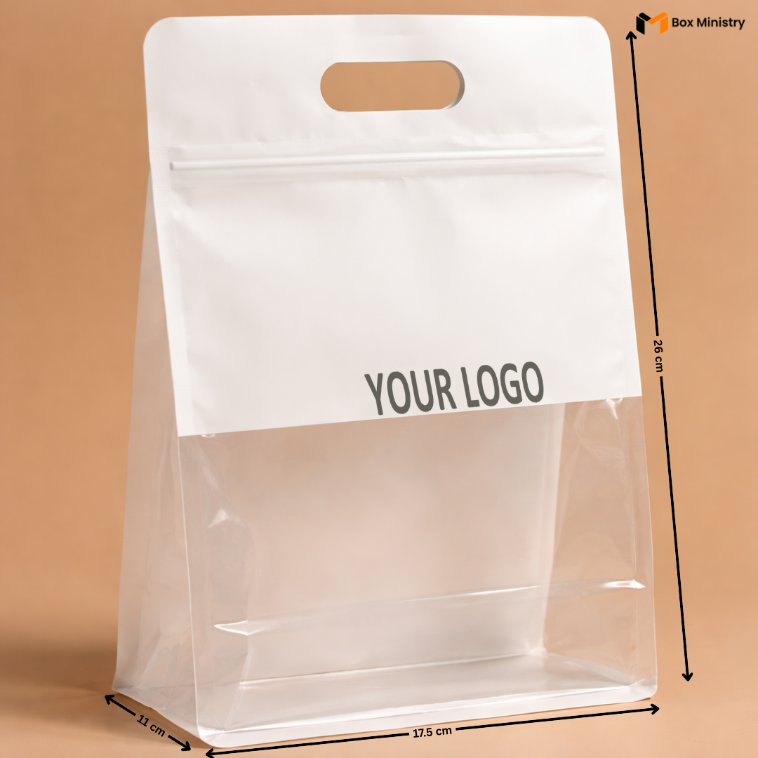 Clear plastic bag with white top section labeled 'YOUR LOGO' on a brown background, with dimensions indicated.