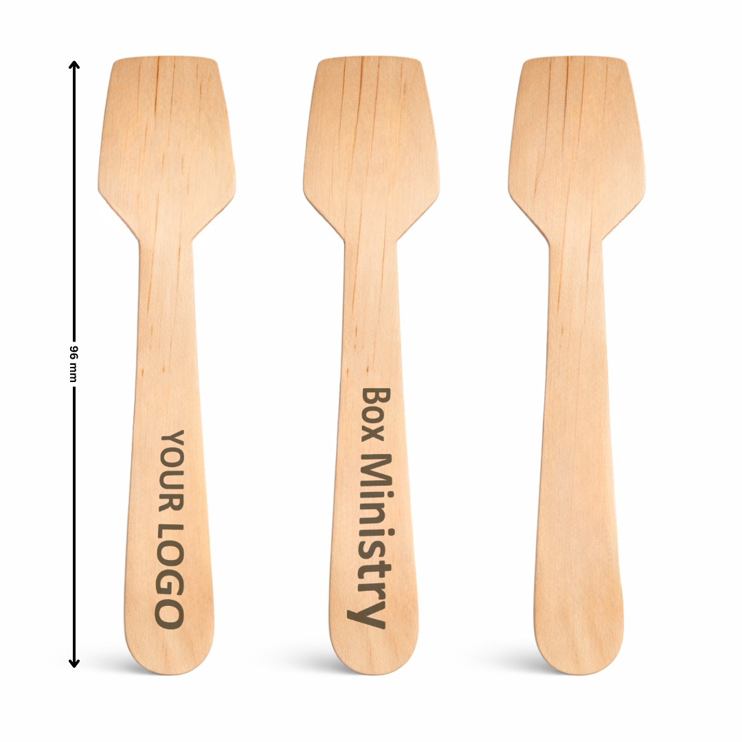 Three wooden spatulas with engraved text on a white background