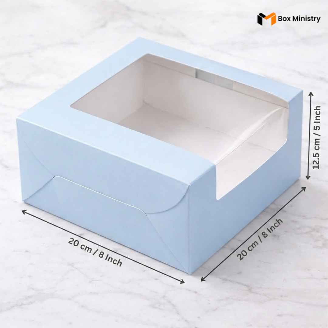 Pastel blue cake box 20x20x12.5cm with L-shape PVC window on white marble background 