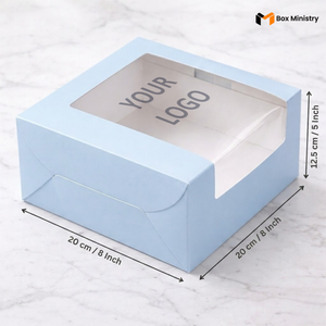 Pastel blue cake box 20x20x12.5cm with L-shape PVC window on white marble background with custom logo print 