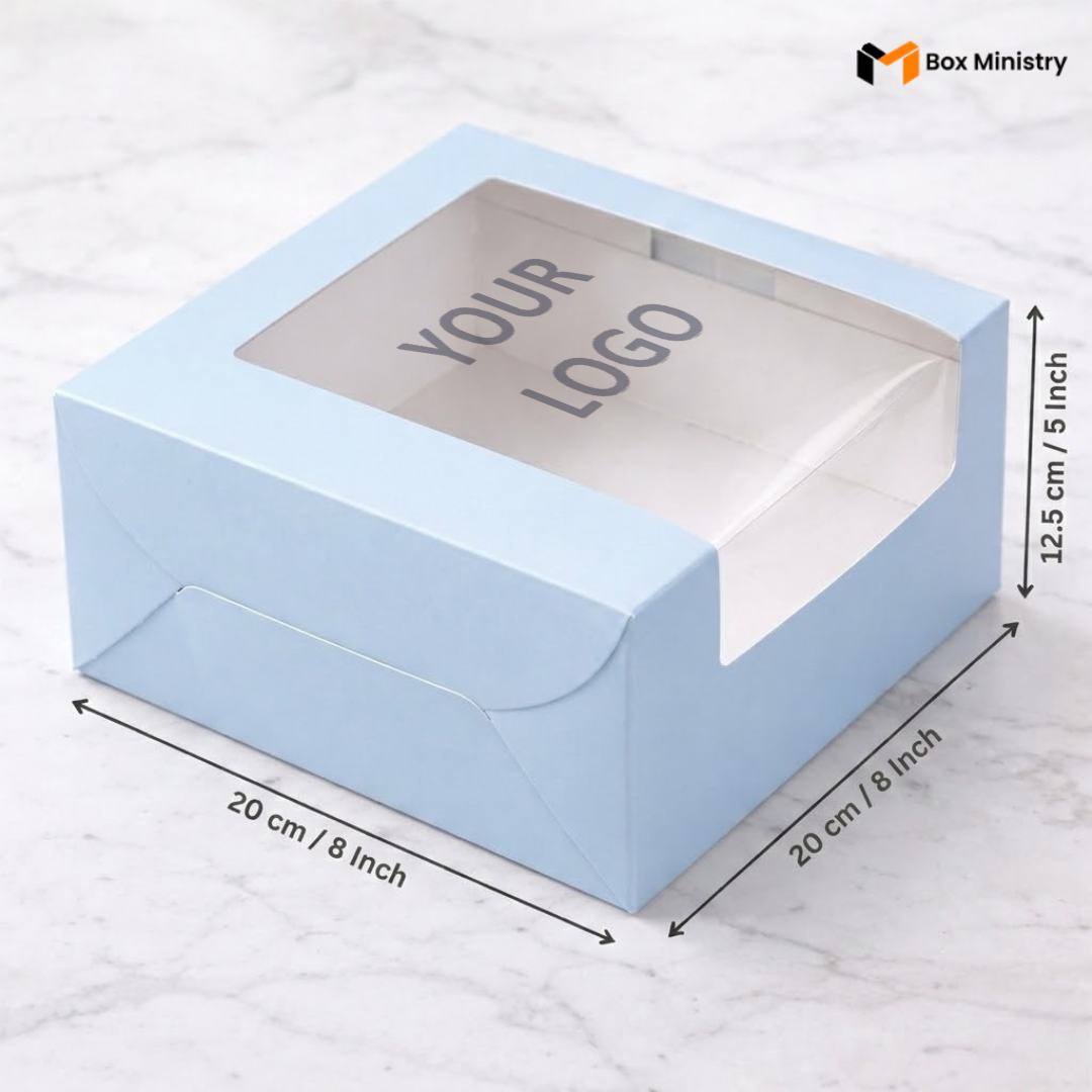 Pastel blue cake box 20x20x12.5cm with L-shape PVC window on white marble background with custom logo print 