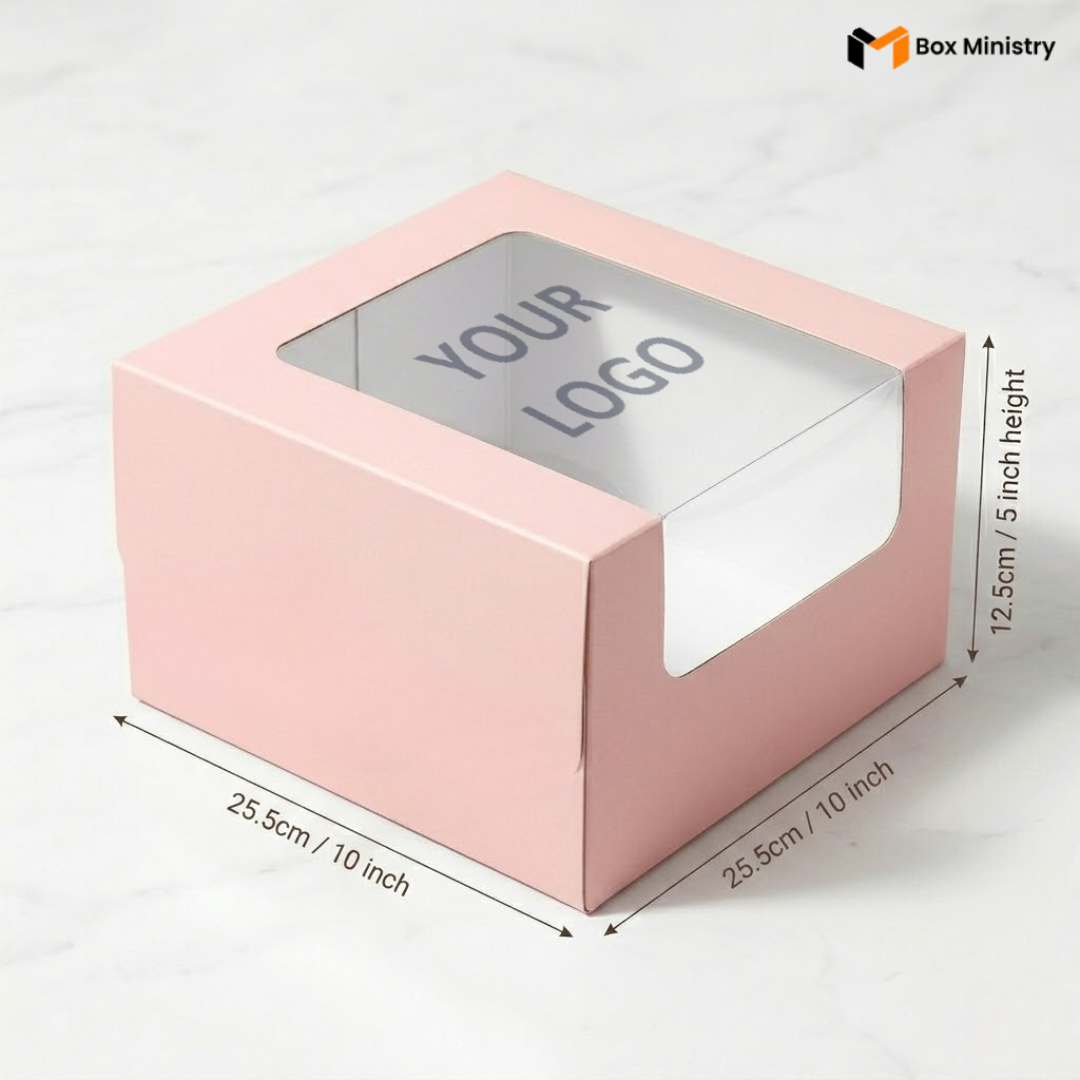Pastel pink cake box 25.5x25.5x12.5cm with L-shape PVC window on white marble background with custom logo print 