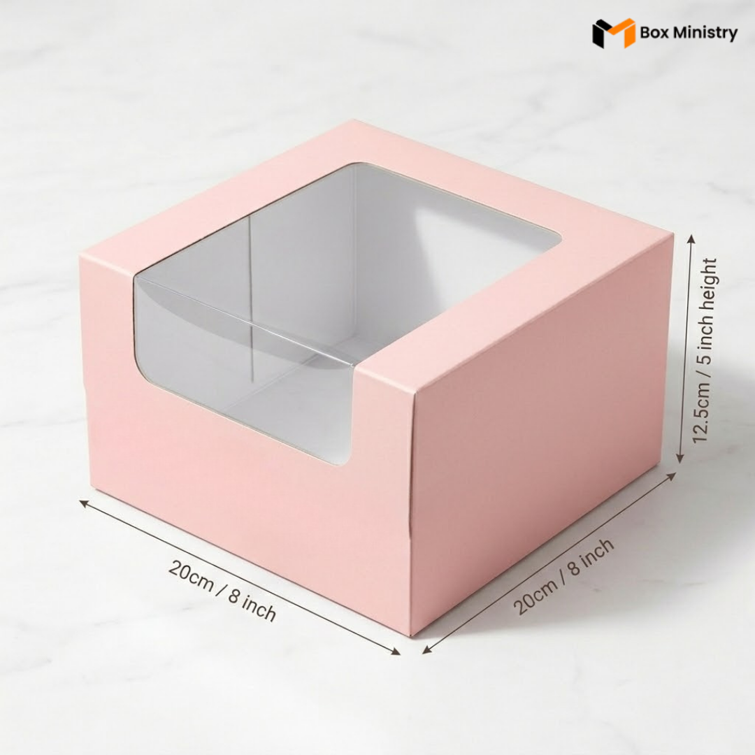 Pastel pink cake box 20x20x12.5cm with L-shape PVC window on white marble background