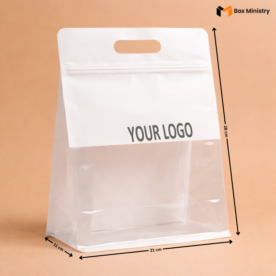 Clear plastic bag with white label for branding, dimensions indicated, on a beige background.