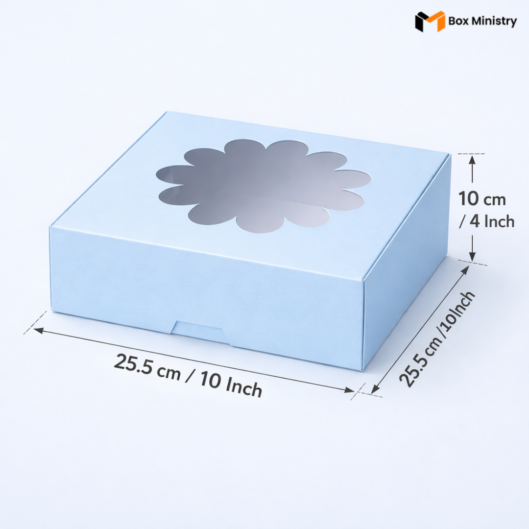 Sky blue flower window cake box 25.5x25.5x10 cm (10x10x4 inch) with decorative flower-shaped PVC window on top showing clear interior, dimensions labeled with measurement arrows on pale icy blue background — Blue Flower Window Cake Box .