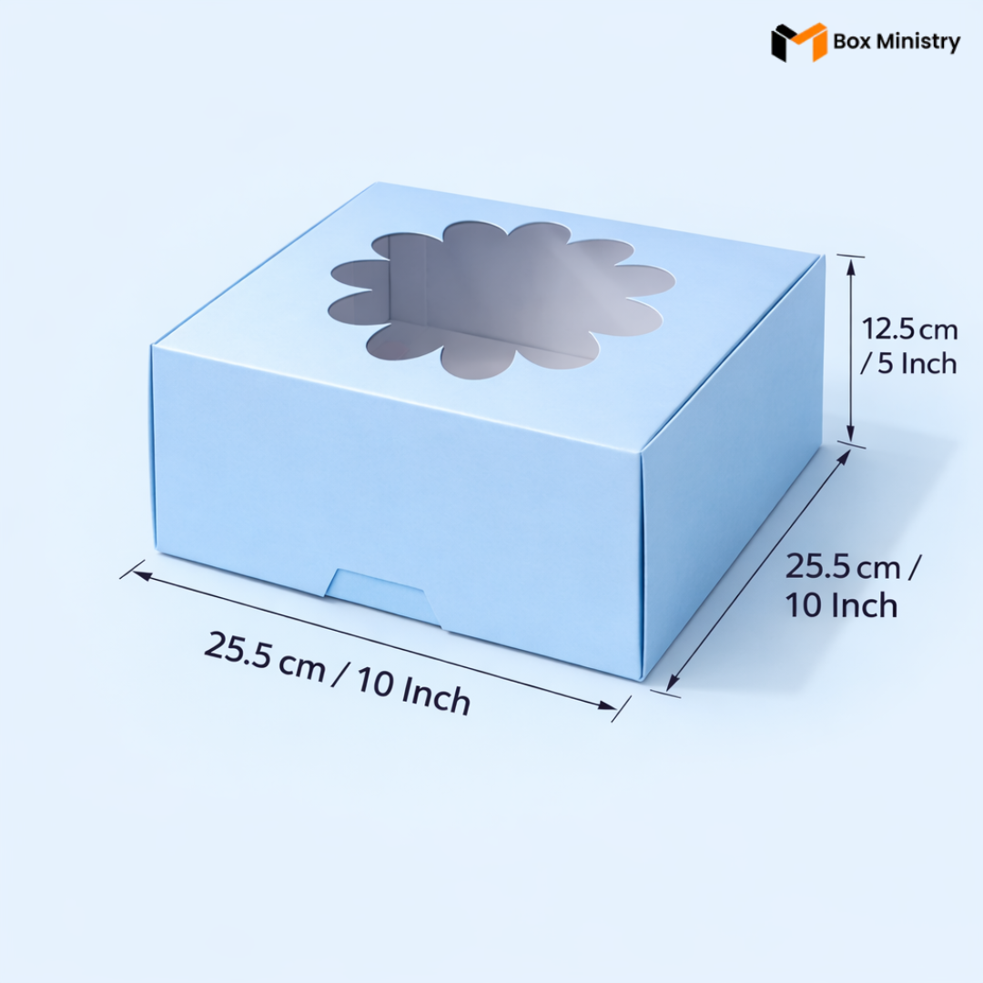 Sky blue flower window cake box 25.5x25.5x12.5 cm (10x10x5 inch) with decorative flower-shaped PVC window on top showing clear interior, taller 5 inch height version clearly visible, dimensions labeled with measurement arrows on pale icy blue background — Blue Flower Window Cake Box .