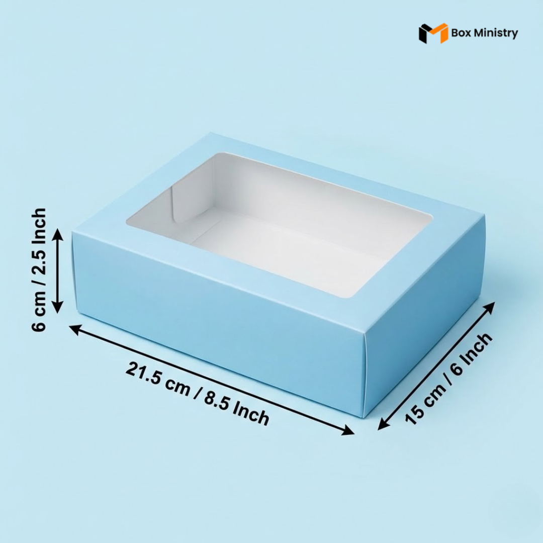 Blue box with a clear window and measurements on a white background, featuring the Box Ministry logo.