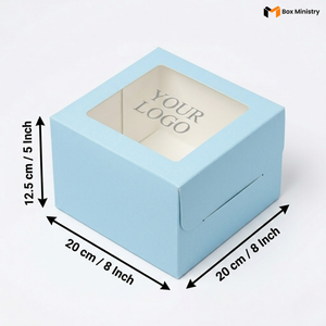 Soft sky blue square cake box with large square clear PVC window on lid showing "YOUR LOGO" text in elegant serif grey font on white interior base, dimensions 20 x 20 x 12.5 cm (8 x 8 x 5 inches), shown in 3/4 isometric angle with bold black measurement arrows on left and bottom edges, visible tuck-lock flap on right side face, matte finish, on a soft pure white background
