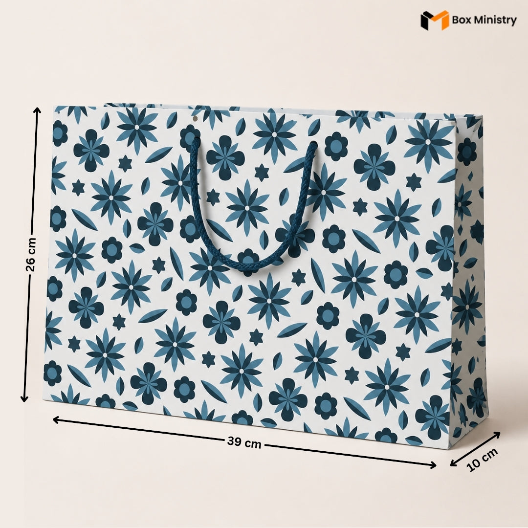 Floral patterned paper bag with measurements on a white background