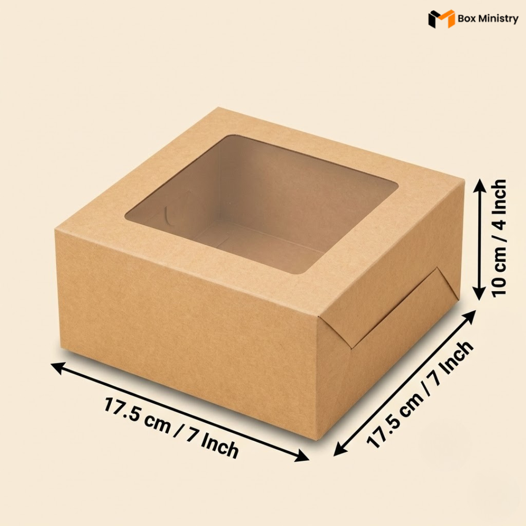 Kraft brown cake box with transparent PVC window lid, dimensions 17.5 x 17.5 x 10 cm (7 x 7 x 4 inches), shown in isometric view on a cream background