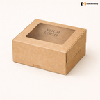 Natural kraft brown square window cake box with large square clear PVC window on lid showing "YOUR LOGO" text in elegant serif dark brown font centered on kraft interior base, positioned at 3/4 isometric angle, wider than it is tall flat compact shape, visible tuck-lock flap on front face, unbleached matte natural paper texture finish, on a soft pure white background