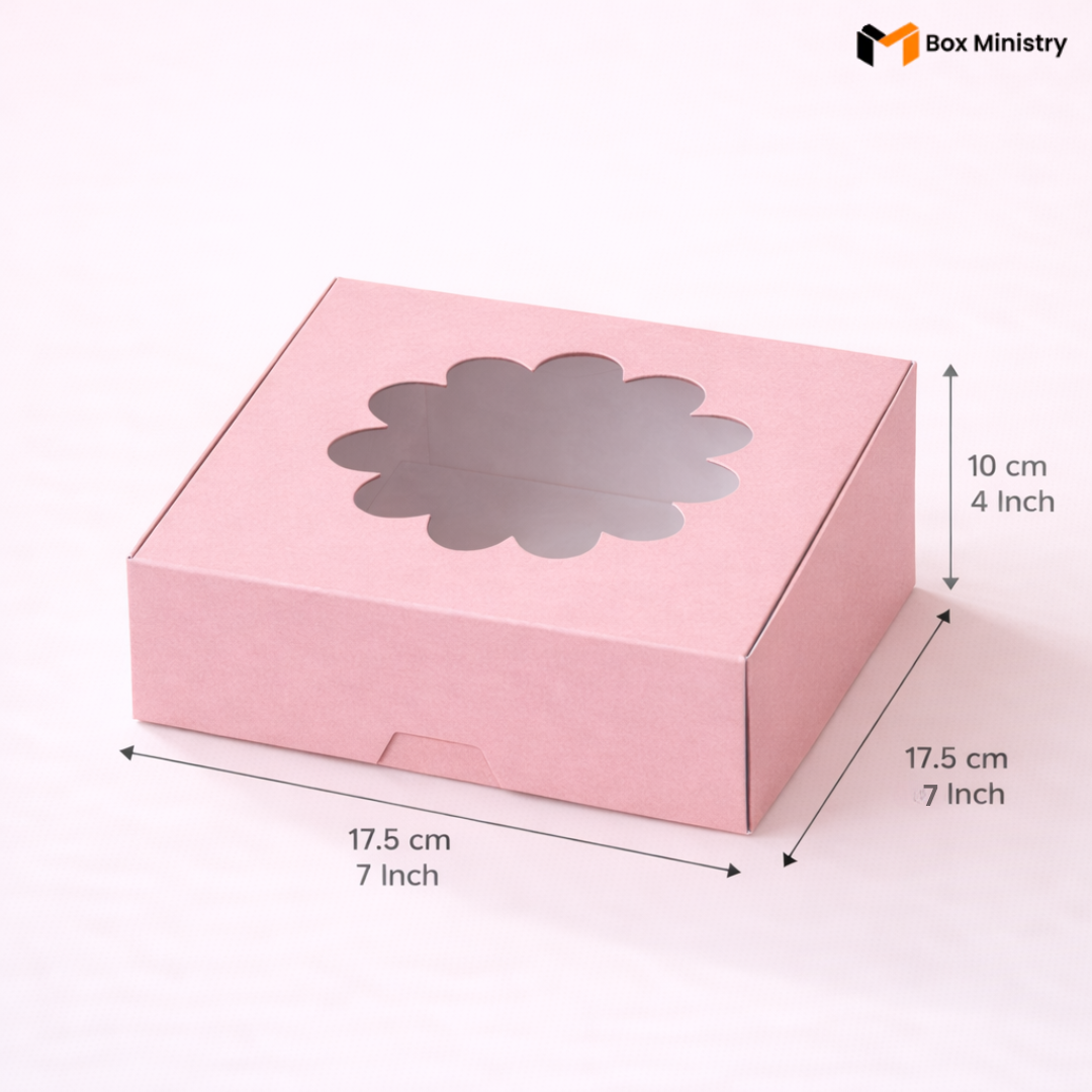 Pink flower window cake box 17.5x17.5x10 cm (7x7x4 inch) with decorative flower-shaped PVC window on top showing clear interior, dimensions labeled with measurement arrows on pale pink background — Pink Flower Window Cake Box 