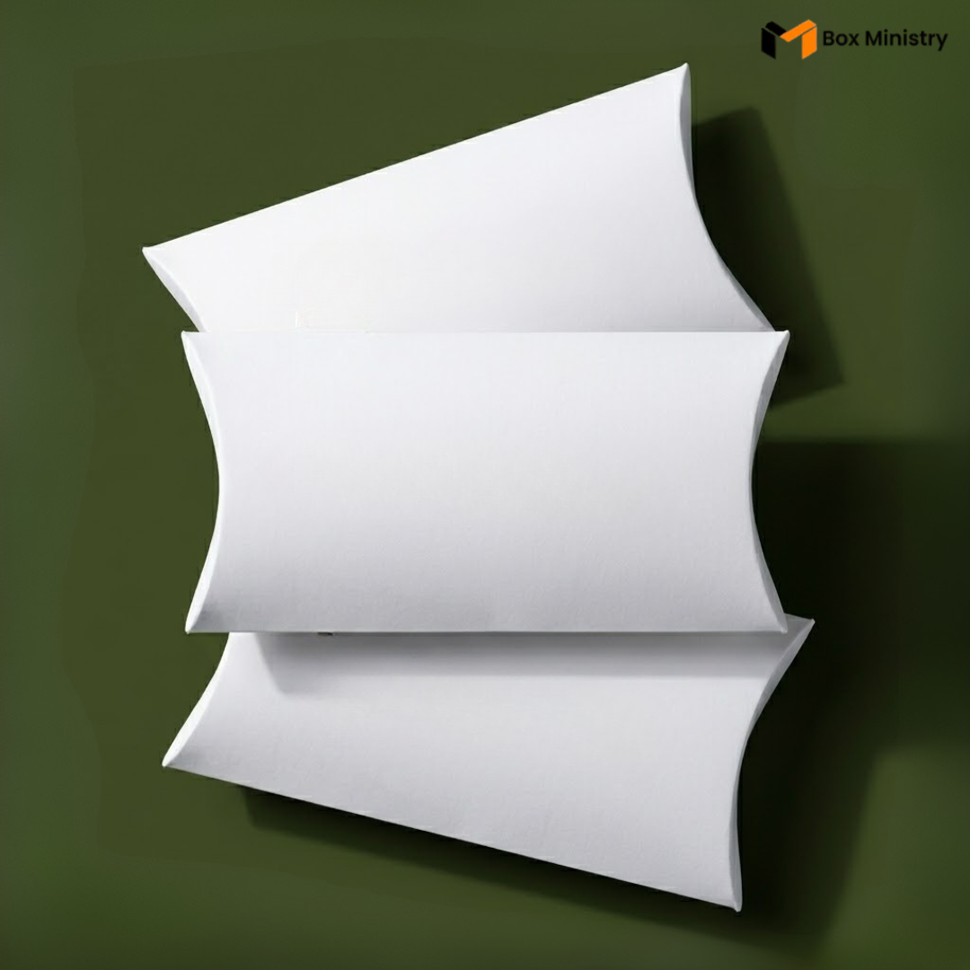 Three white pillows stacked on a green background