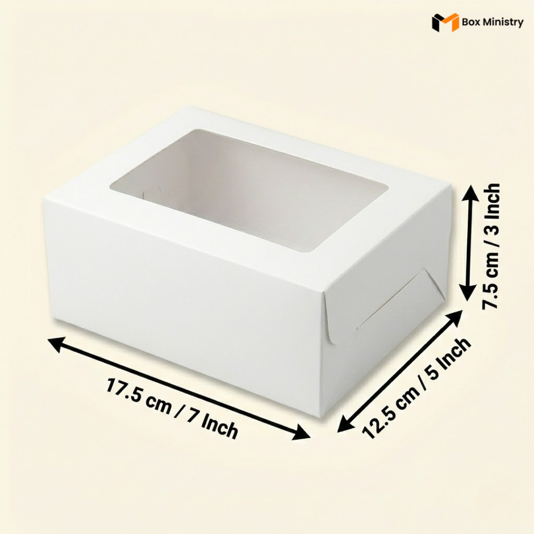 White rectangular window cake box 17.5x12.5x7.5 cm (7x5x3 inch) with large clear rectangular PVC window on top showing white interior, dimensions labeled with measurement arrows on warm pale cream background — White Rectangular Window Cake Box 