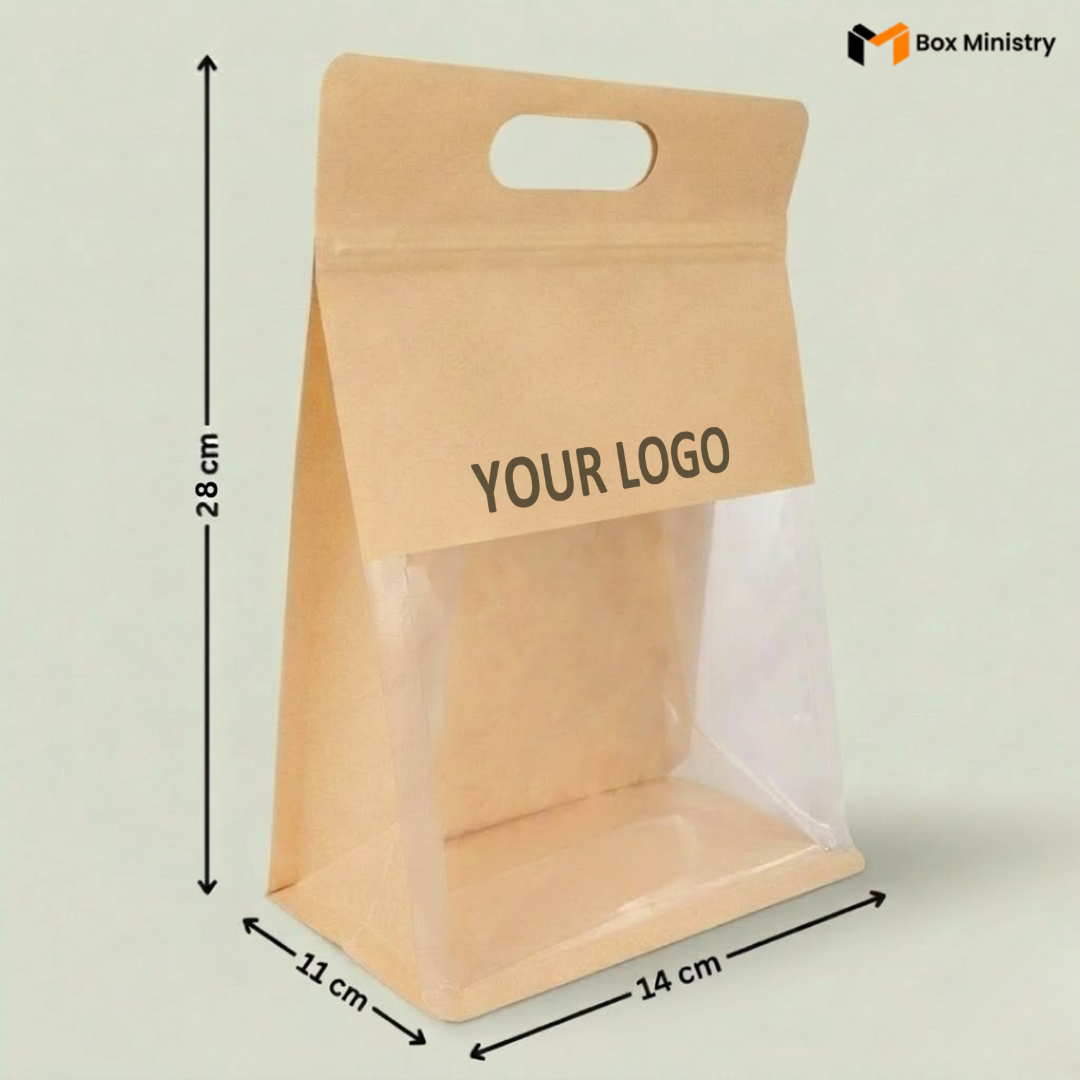 Kraft paper bag with clear window and dimensions labeled, featuring 'Box Ministry' logo.