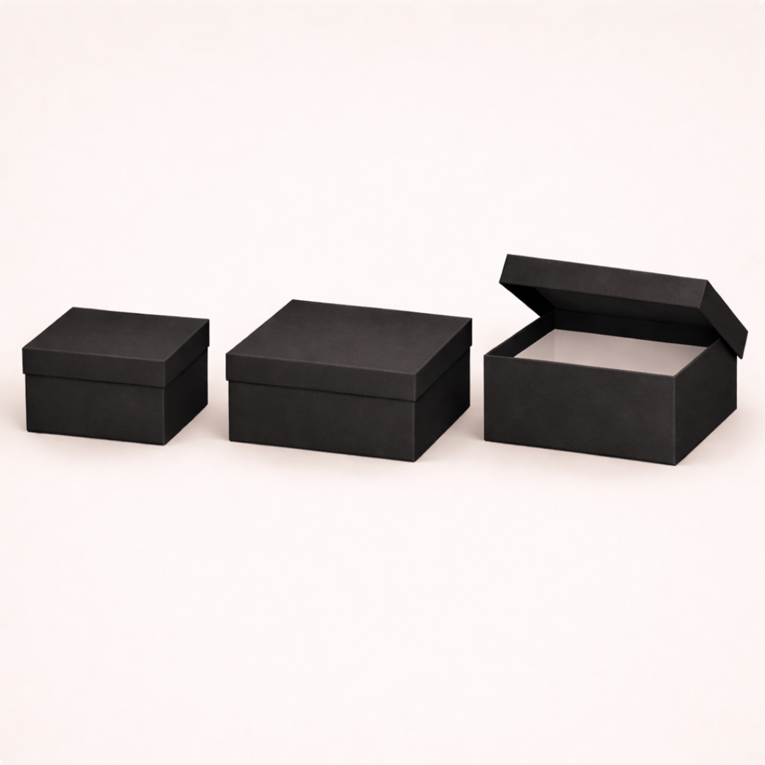 Three black cardboard boxes of different sizes on a white background